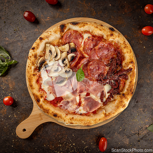 Image of Freshly baked four seasons pizza