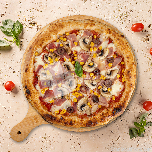 Image of Delicious pizza with ham