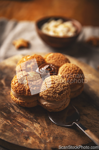 Image of Delicious cream puffs forming flower shape