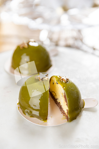 Image of Delicious pistachio and chocolate dome cakes