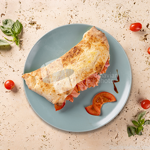 Image of Delicious calzone with salmon,