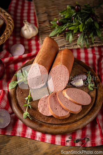 Image of Savory sausages, is presented sliced