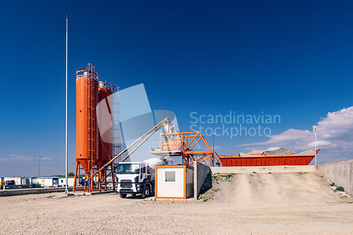Image of Concrete mixing plant with truck