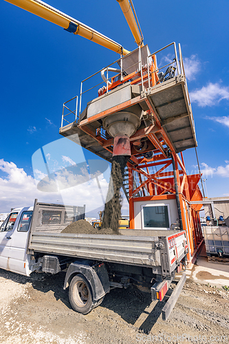 Image of Asphalt mixing plant loading asphalt mix