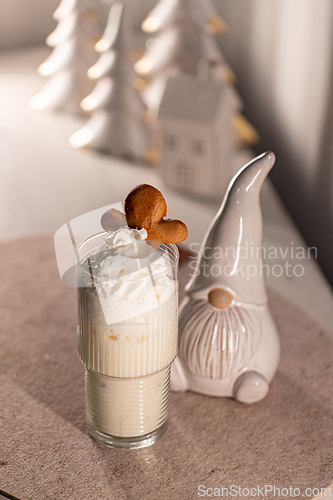 Image of Eggnog cocktail decorated with gingerbread man