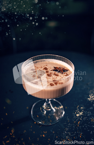 Image of Festive eggnog cocktail is garnished with cinnamon