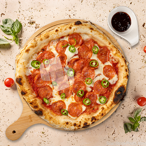Image of Delicious pepperoni pizza with melted mozzarella