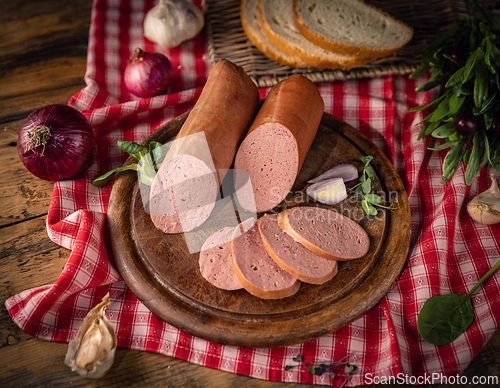 Image of Sliced headcheese with red onions