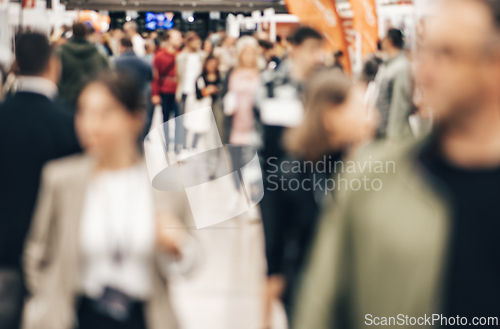 Image of Abstract blurred people at exhibition hall of expo event trade show. Business convention show or job fair. Business concept background.