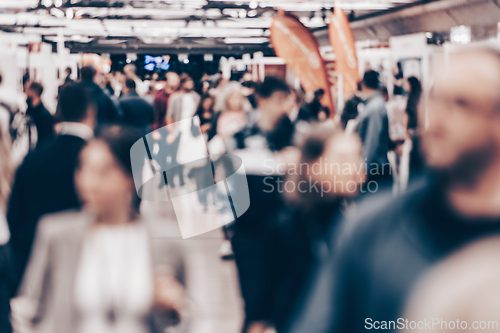 Image of Abstract blurred people at exhibition hall of expo event trade show. Business convention show or job fair. Business concept background.