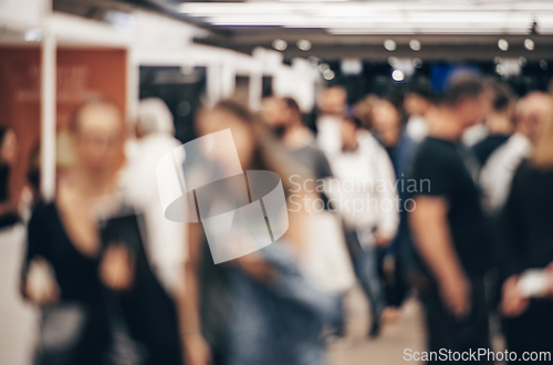 Image of Abstract blurred people at exhibition hall of expo event trade show. Business convention show or job fair. Business concept background.
