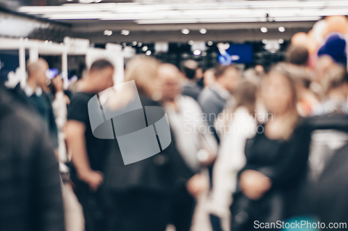 Image of Abstract blurred people at exhibition hall of expo event trade show. Business convention show or job fair. Business concept background.