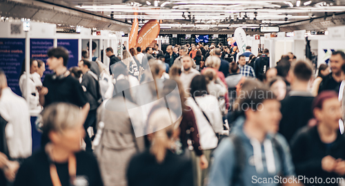 Image of Abstract blurred people at exhibition hall of expo event trade show. Business convention show or job fair. Business concept background.