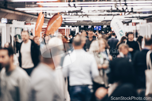 Image of Abstract blurred people at exhibition hall of expo event trade show. Business convention show or job fair. Business concept background.