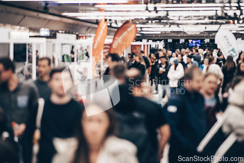 Image of Abstract blurred people at exhibition hall of expo event trade show. Business convention show or job fair. Business concept background.