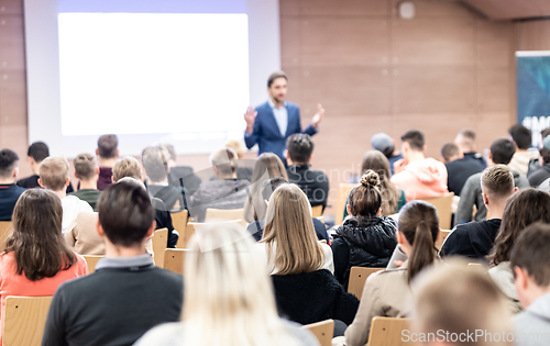 Image of Business speaker giving a talk at business conference event.