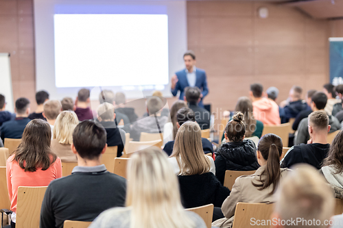 Image of Business speaker giving a talk at business conference event.