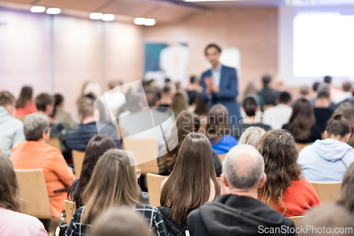 Image of Business speaker giving a talk at business conference event.