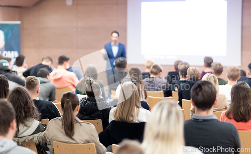 Image of Business speaker giving a talk at business conference event.