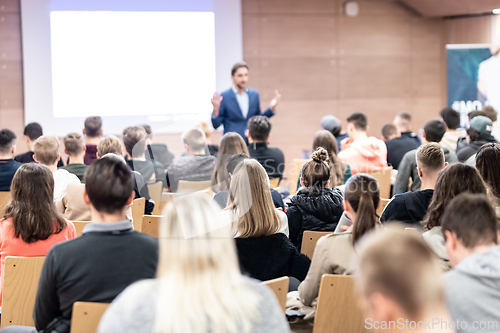 Image of Business speaker giving a talk at business conference event.
