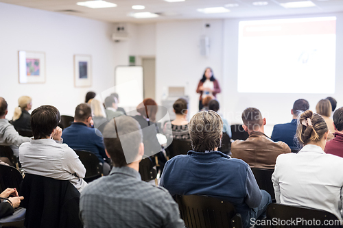 Image of Woman giving presentation on business conference workshop.