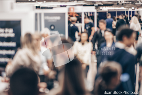 Image of Abstract blurred people at exhibition hall of expo event trade show. Business convention show or job fair. Business concept background.