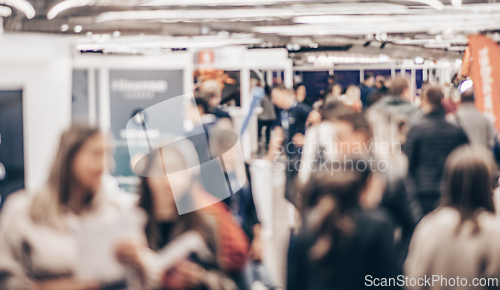 Image of Abstract blurred people at exhibition hall of expo event trade show. Business convention show or job fair. Business concept background.