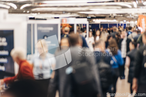 Image of Abstract blurred people at exhibition hall of expo event trade show. Business convention show or job fair. Business concept background.