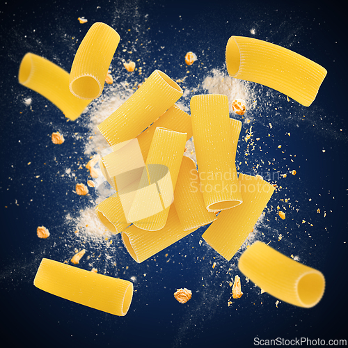 Image of Raw rigatoni pasta exploding