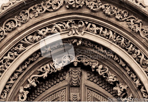 Image of Tympanum of an old door, sepia toned