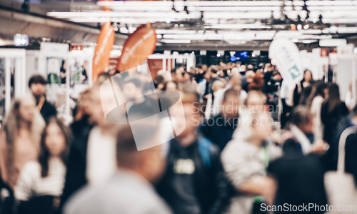 Image of Abstract blurred people at exhibition hall of expo event trade show. Business convention show or job fair. Business concept background.