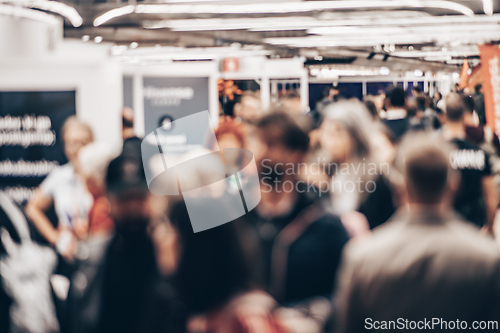 Image of Abstract blurred people at exhibition hall of expo event trade show. Business convention show or job fair. Business concept background.