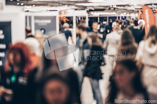 Image of Abstract blurred people at exhibition hall of expo event trade show. Business convention show or job fair. Business concept background.
