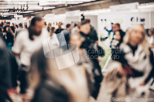 Image of Abstract blurred people at exhibition hall of expo event trade show. Business convention show or job fair. Business concept background.
