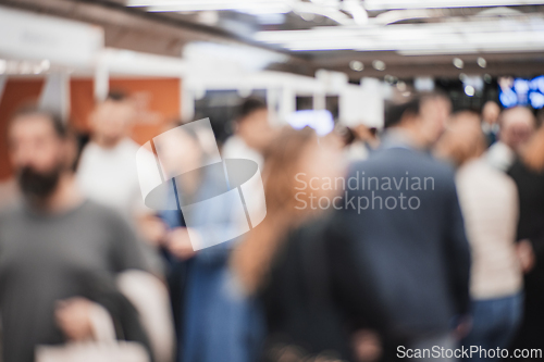 Image of Abstract blurred people at exhibition hall of expo event trade show. Business convention show or job fair. Business concept background.