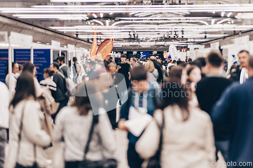 Image of Abstract blurred people at exhibition hall of expo event trade show. Business convention show or job fair. Business concept background.