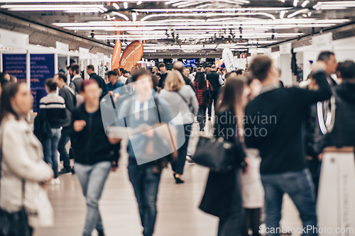 Image of Abstract blurred people at exhibition hall of expo event trade show. Business convention show or job fair. Business concept background.
