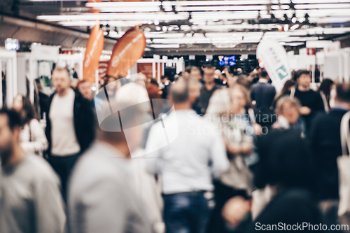 Image of Abstract blurred people at exhibition hall of expo event trade show. Business convention show or job fair. Business concept background.