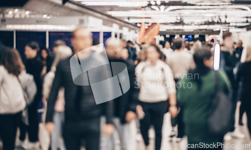 Image of Abstract blurred people at exhibition hall of expo event trade show. Business convention show or job fair. Business concept background.