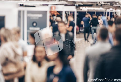 Image of Abstract blurred people at exhibition hall of expo event trade show. Business convention show or job fair. Business concept background.