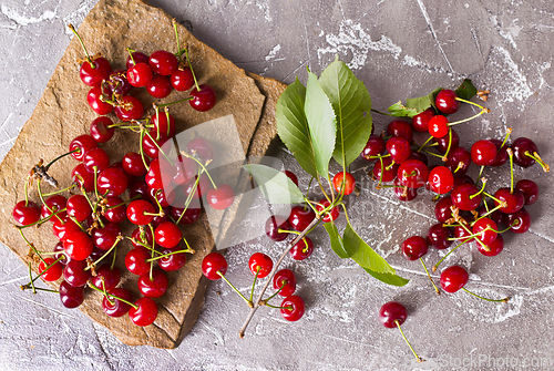 Image of Sweet cherry on stone tray on a table