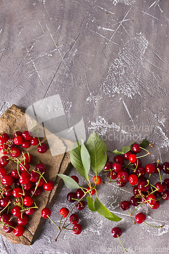 Image of Sweet cherry on stone tray on a table