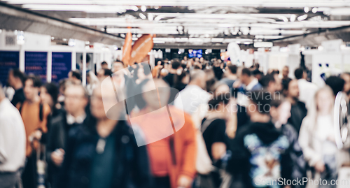 Image of Abstract blurred people at exhibition hall of expo event trade show. Business convention show or job fair. Business concept background.