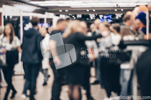 Image of Abstract blurred people at exhibition hall of expo event trade show. Business convention show or job fair. Business concept background.