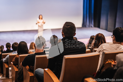 Image of Woman giving presentation on business conference event.