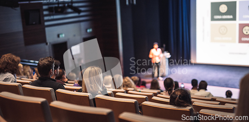Image of Woman giving presentation on business conference event.