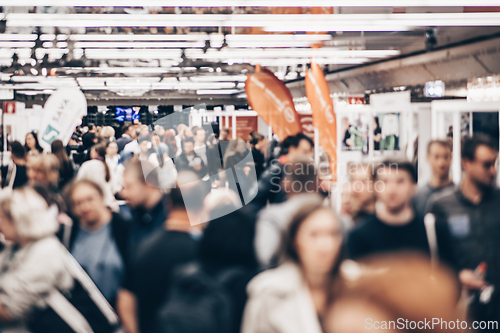 Image of Abstract blurred people at exhibition hall of expo event trade show. Business convention show or job fair. Business concept background.