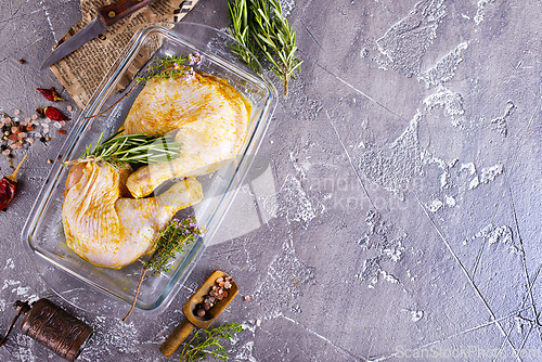 Image of Raw chicken leg quarters