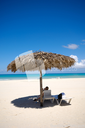 Image of Parasol on exotic beach
