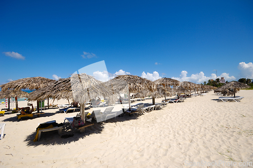 Image of Beach with parasols and sunbeds